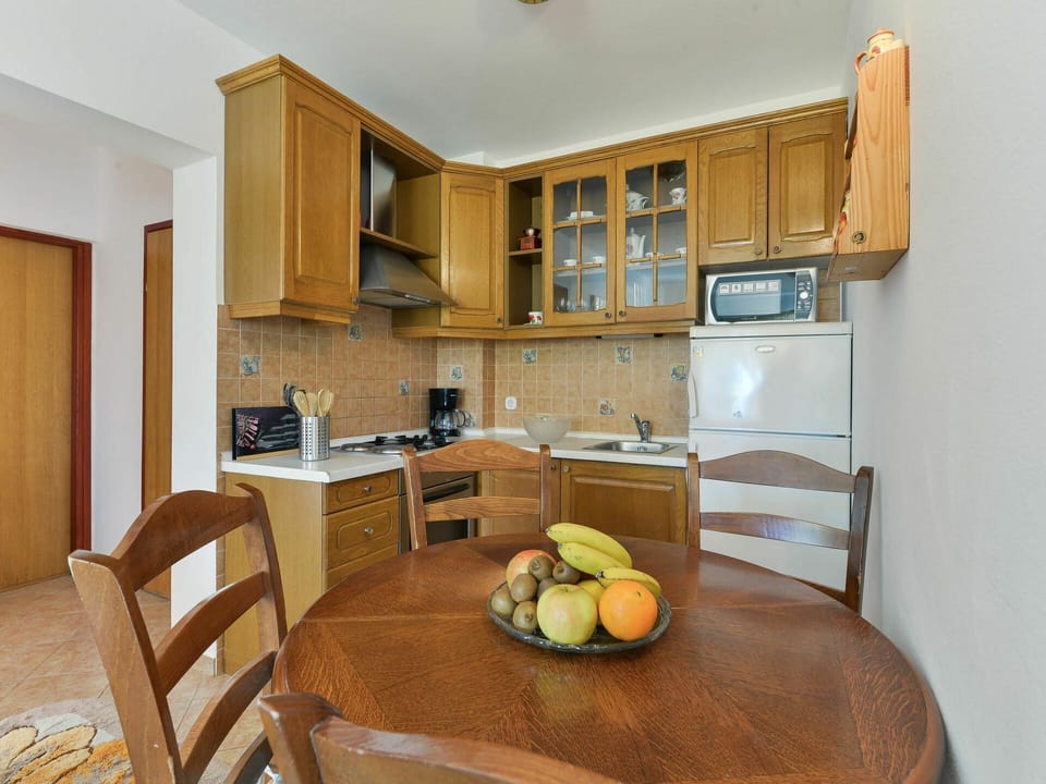 Table, Cabinetry, Furniture, Countertop, Chair, Kitchen Appliance, Home Appliance, Wood, Kitchen, Interior Design