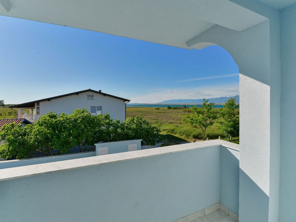 Sky, Plant, Azure, Shade, Land Lot, Building, Rectangle, Composite Material, Landscape