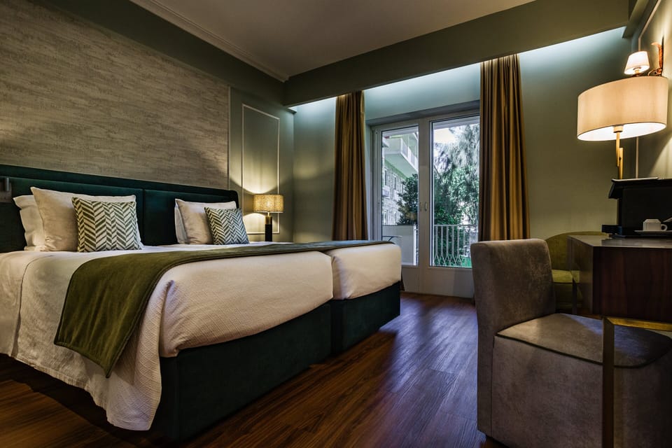 Superior Twin Room | Minibar, in-room safe, individually decorated, individually furnished