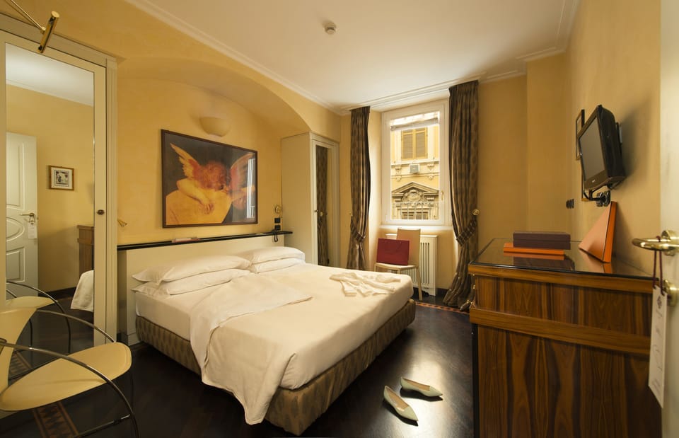 Premium bedding, down comforters, pillowtop beds, minibar