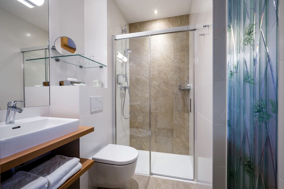 Shower, free toiletries, hair dryer, slippers