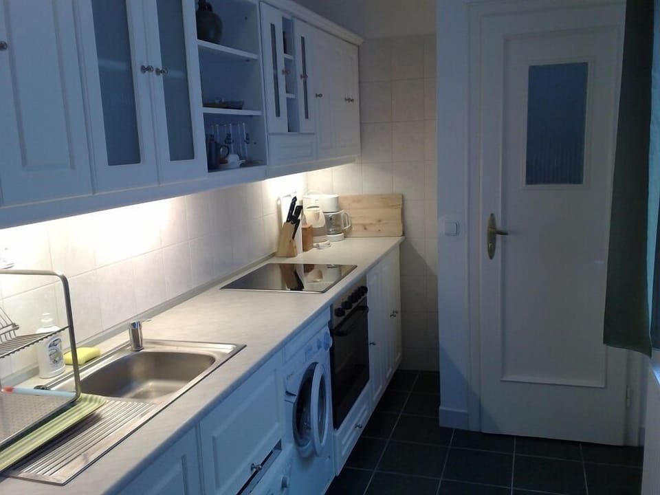 Full-size fridge, coffee/tea maker, cookware/dishes/utensils