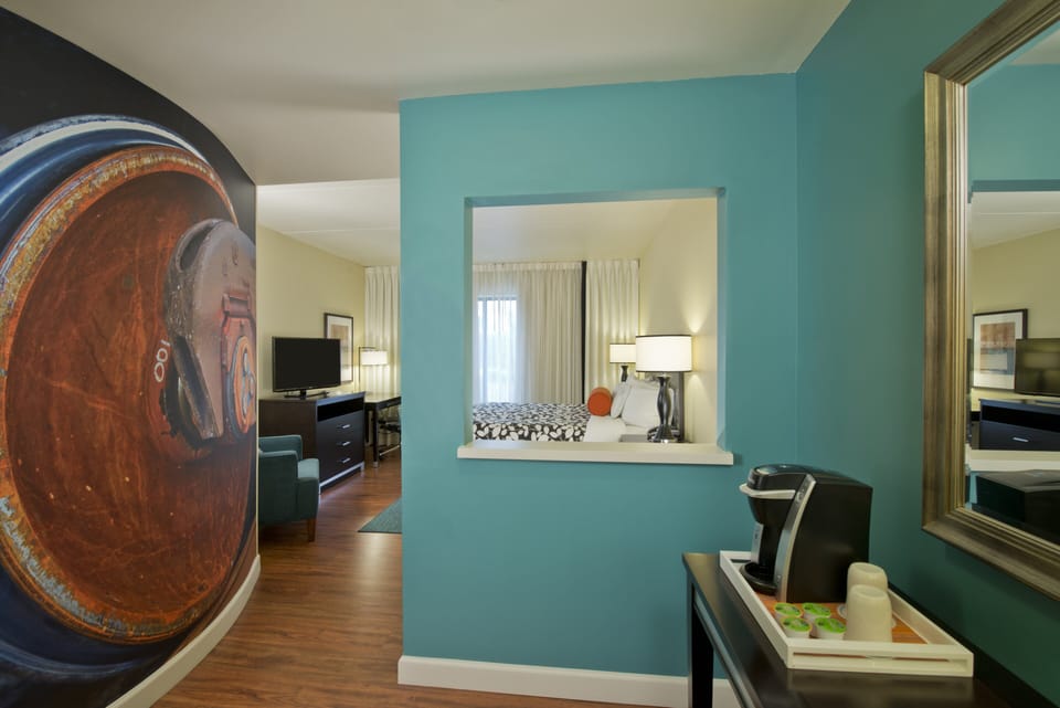 Premium bedding, desk, laptop workspace, blackout drapes