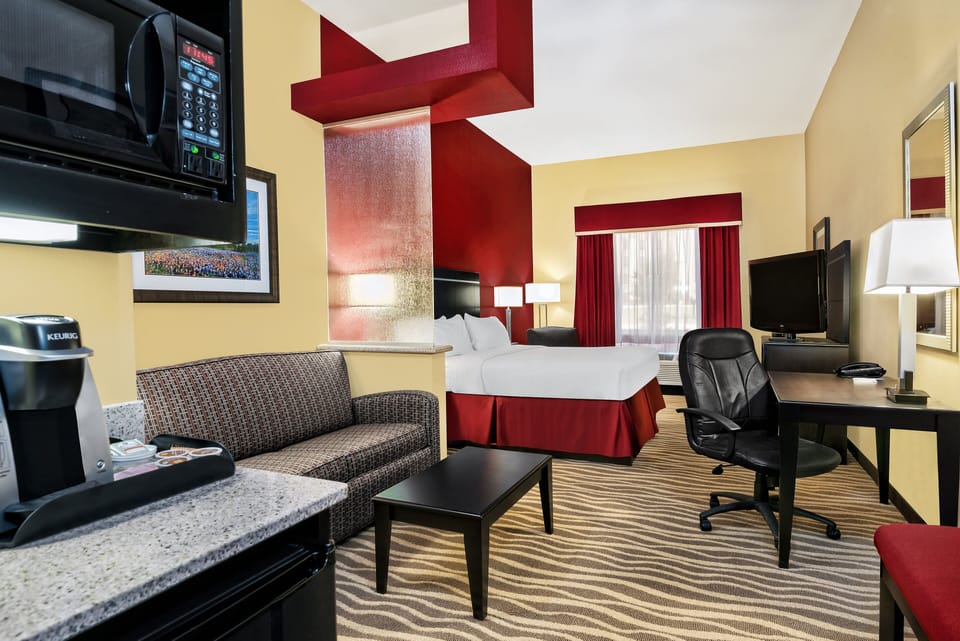Suite, 1 King Bed | In-room safe, desk, iron/ironing board, free cribs/infant beds