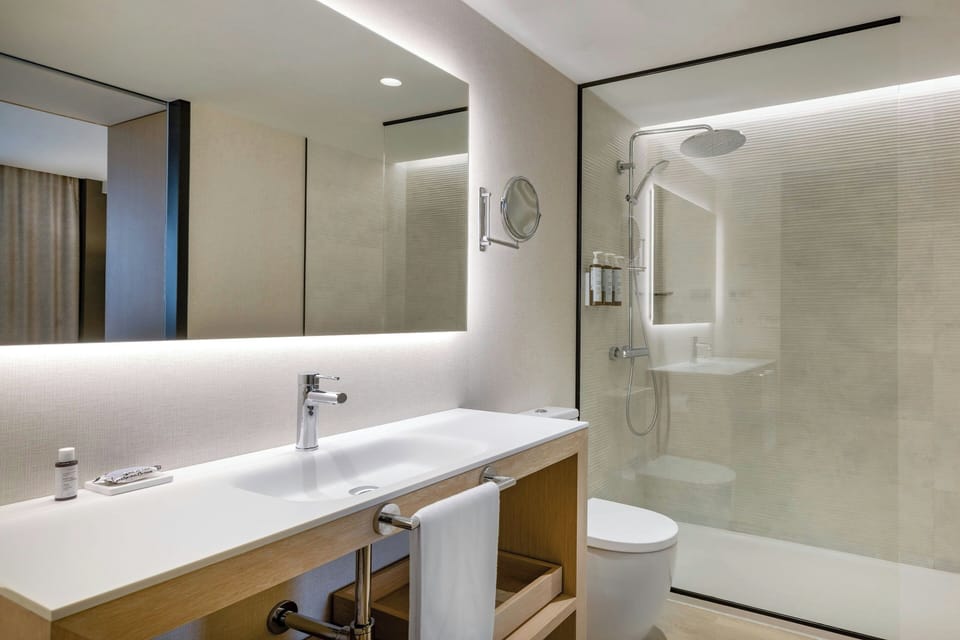 Combined shower/tub, designer toiletries, hair dryer, bathrobes