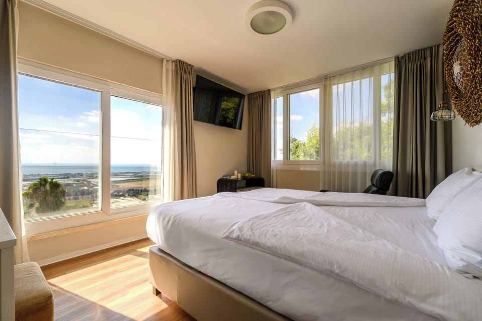 Deluxe Double Room, Ocean View | Blackout drapes, iron/ironing board, free WiFi, bed sheets
