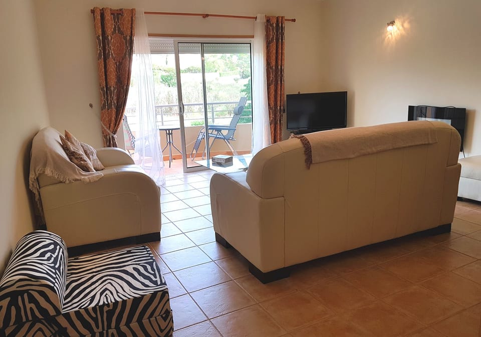 Delightful lounge with doors to the spacious veranda