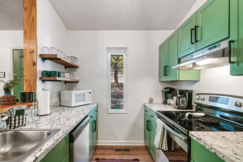 Kitchen w/ essentials. We have a regular coffee pot and Keurig!