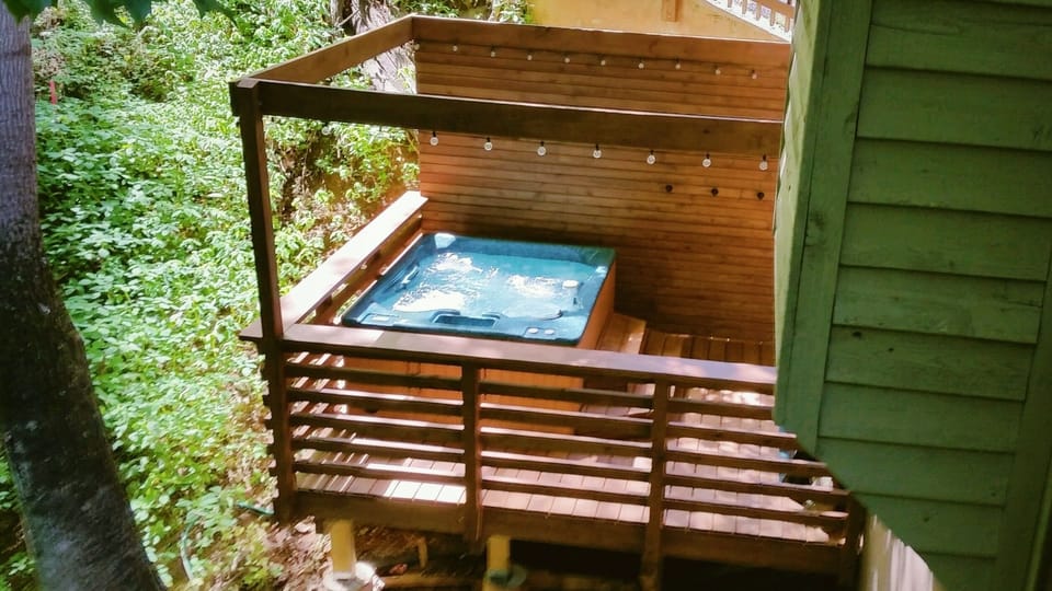 Relax in the hot tub surrounded by trees