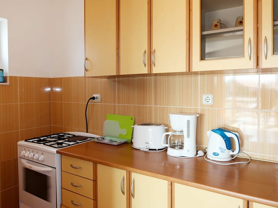 Countertop, Room, Cabinetry, Property, Kitchen, Furniture, Interior Design, Tile, Sink, Building