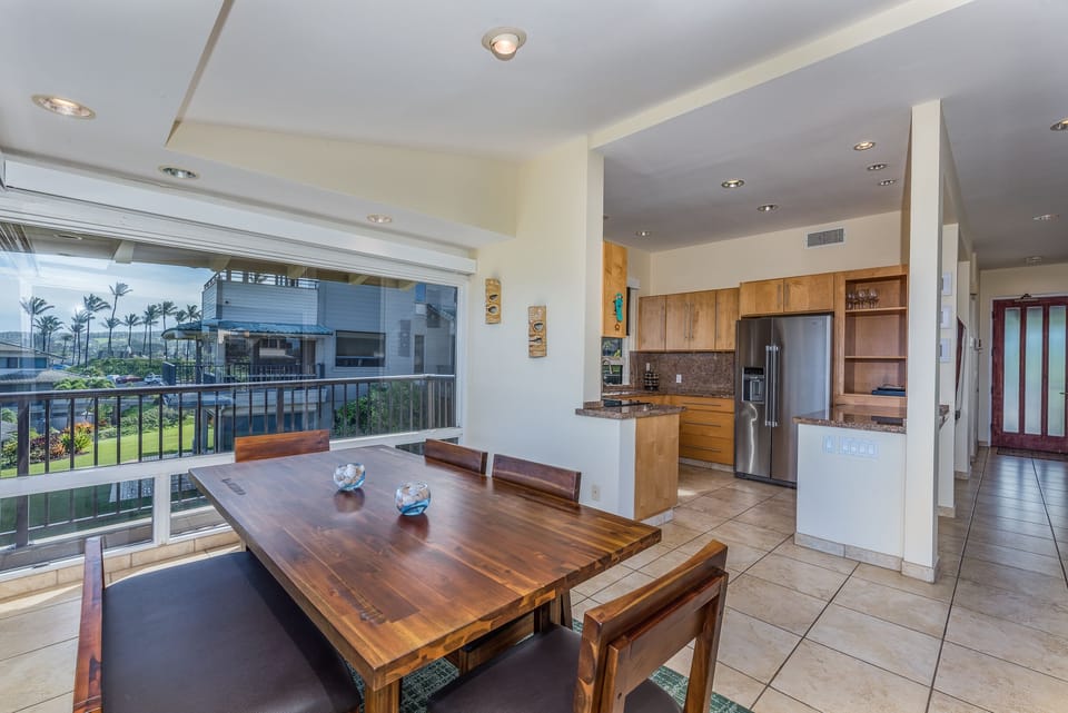 Gather around a stylish dining table with a bench and four chairs — perfect for laid-back meals, game nights, or sharing stories after a day in the sun.