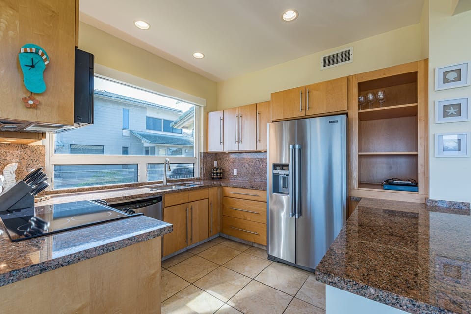 Gourmet Ready - Cook like a chef in the fully equipped kitchen with granite countertops and stainless steel appliances.