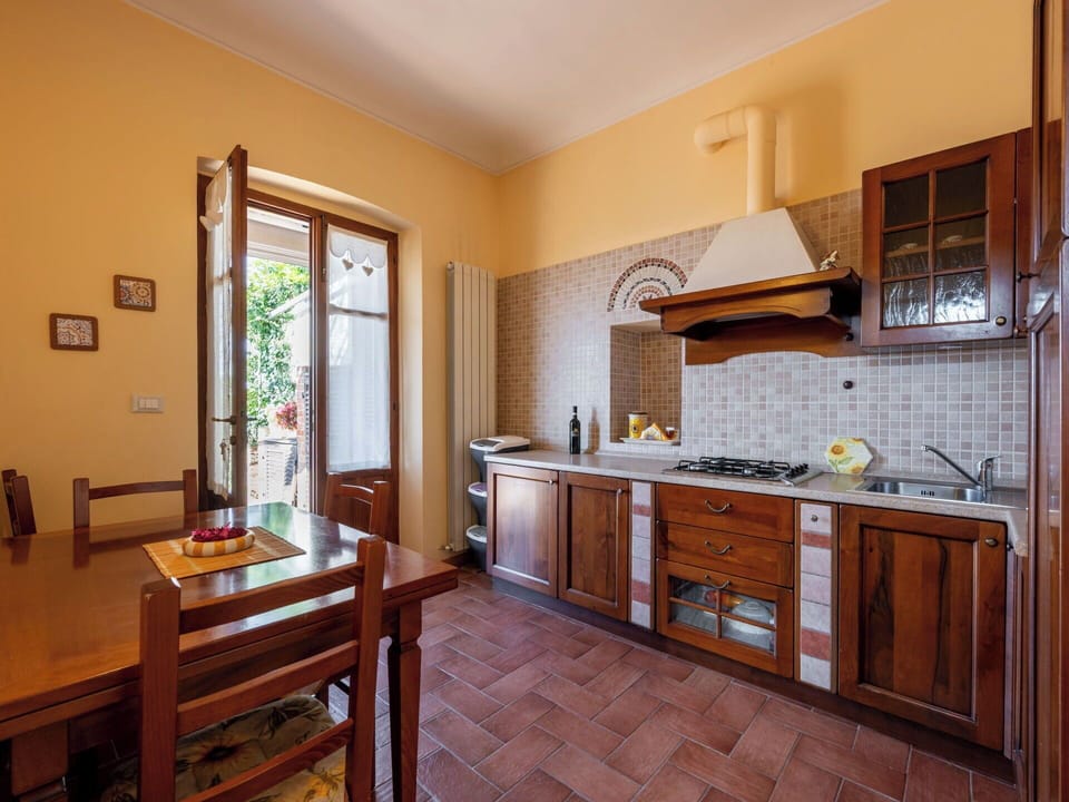 Wood, Interior Design, Flooring, Furniture, Kitchen, Countertop, Floor, Cabinetry, Room, Kitchen Appliance