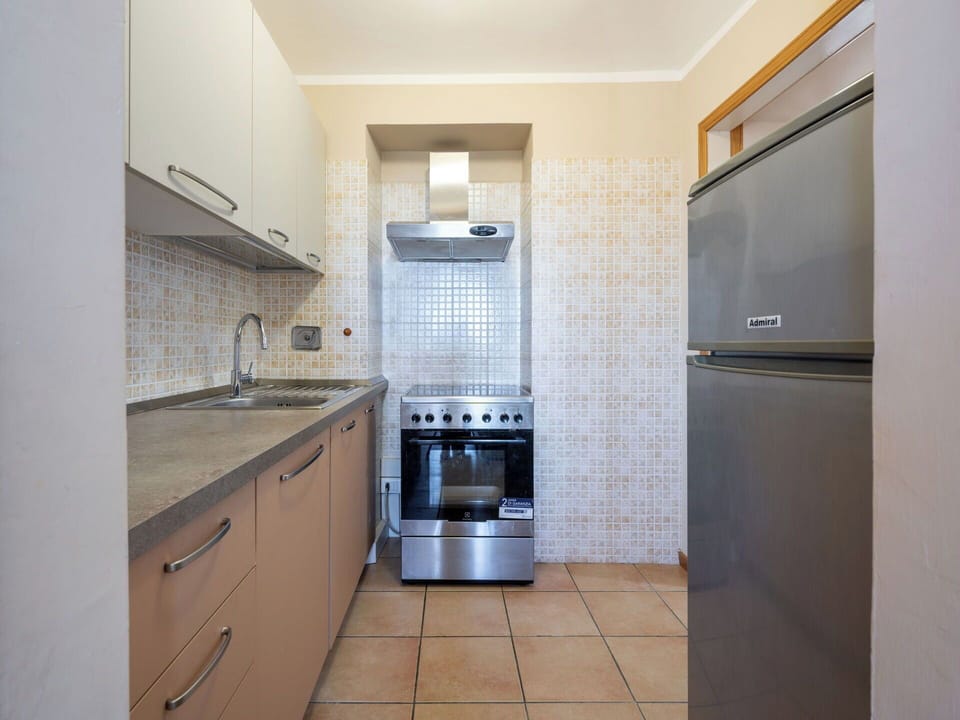 Kitchen, Kitchen Appliance, Countertop, Major Appliance, Flooring, Cabinetry, Interior Design, Floor, Kitchen Sink, Home Appliance