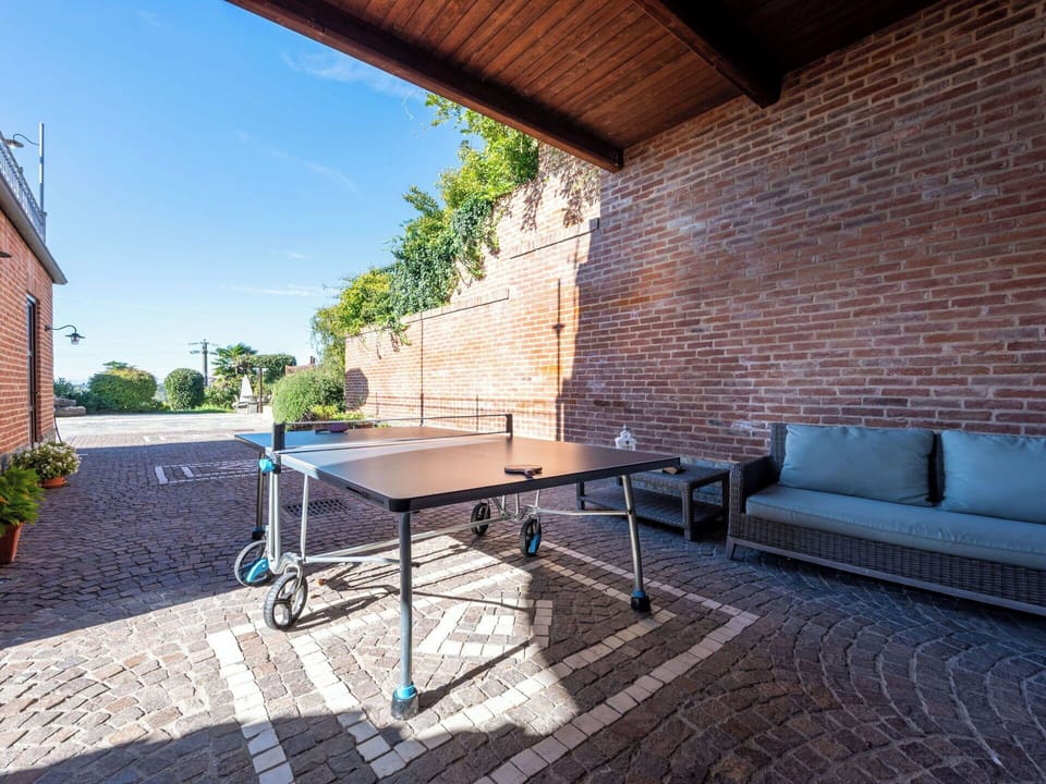 Furniture, Table, Brick, Composite Material, Outdoor Furniture, Chair, Outdoor Table, Brickwork, Racquet Sport, Shade