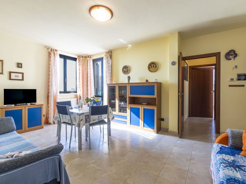 Picture Frame, Furniture, Table, Property, Blue, Television, Building, Wood, Interior Design, Chair
