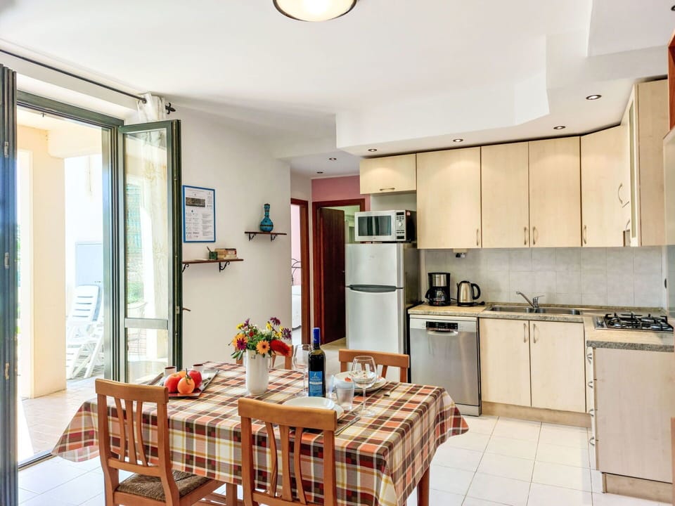 Furniture, Property, Cabinetry, Table, Countertop, Wood, Interior Design, Lighting, Sink, Kitchen