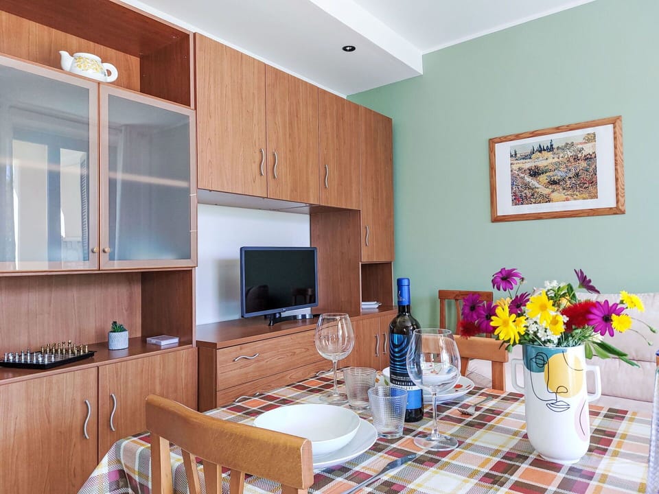 Property, Furniture, Table, Cabinetry, Plant, Flower, Bottle, Interior Design, Wood, Flooring