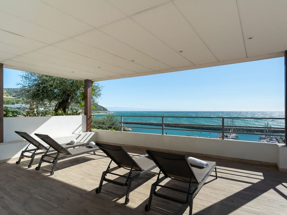 Furniture, Sky, Water, Table, Azure, Chair, Shade, Outdoor Furniture, Swimming Pool, Seaside Resort