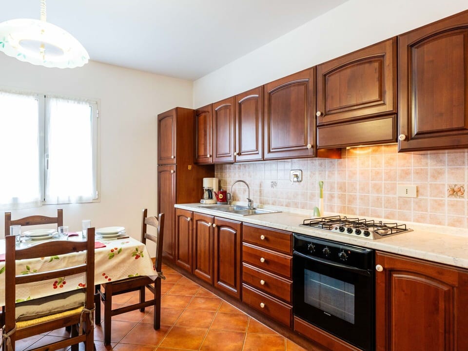 Flooring, Wood, Interior Design, Kitchen, Cabinetry, Floor, Countertop, Room, Furniture, Kitchen Appliance
