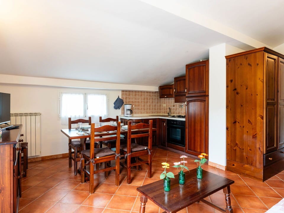 Interior Design, Furniture, Ceiling, Flooring, Kitchen, Cabinetry, Floor, Countertop, Room, Lighting