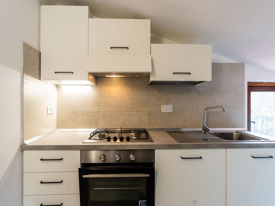 Kitchen, Kitchen Appliance, Countertop, Major Appliance, Kitchen Stove, Cabinetry, Home Appliance, Stove, Interior Design, Gas Stove