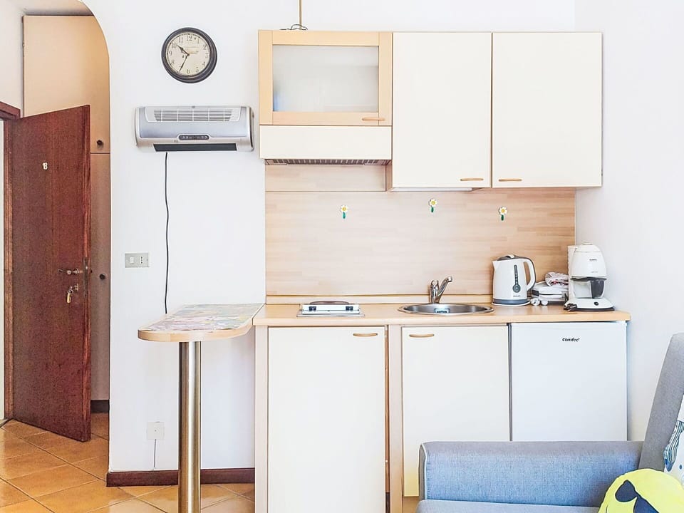 Furniture, Interior Design, Room, Chair, Apartment, Wood Stain, Major Appliance, Kitchen, Desk, Cabinetry