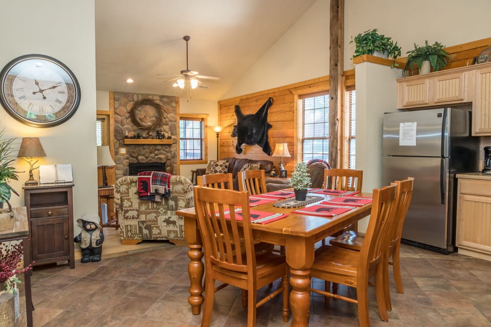Enter the cabin to see the kitchen, den and hallways to 2 master bedrooms.