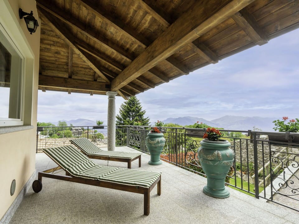 Plant, Sky, Property, Cloud, Building, Wood, Outdoor Furniture, Porch, Shade, Flowerpot