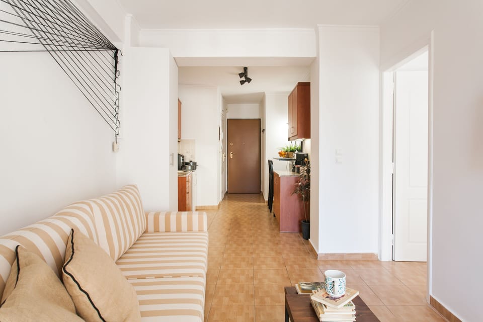 Apartment, 1 Bedroom | Living room | 32-inch flat-screen TV with cable channels, Smart TV, Netflix