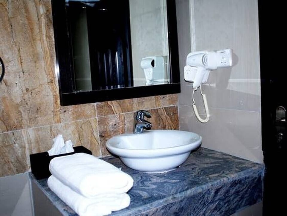 Shower, slippers, towels, soap