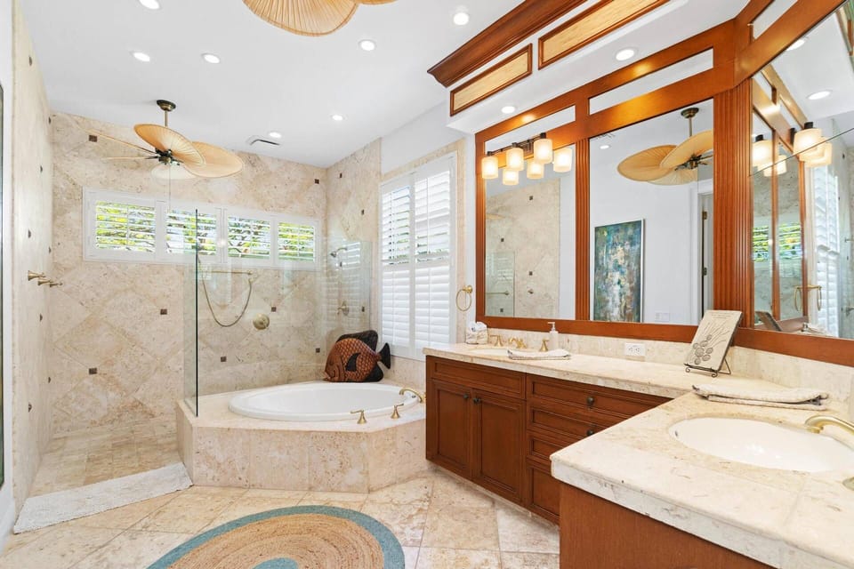 The master bath features dual vanities, large soaking tub, walk-in shower and separate water closet.