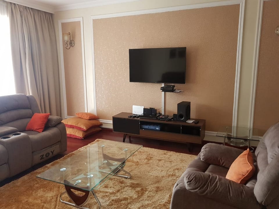 Apartment, 4 Bedrooms | Living area | 32-inch flat-screen TV with satellite channels, TV