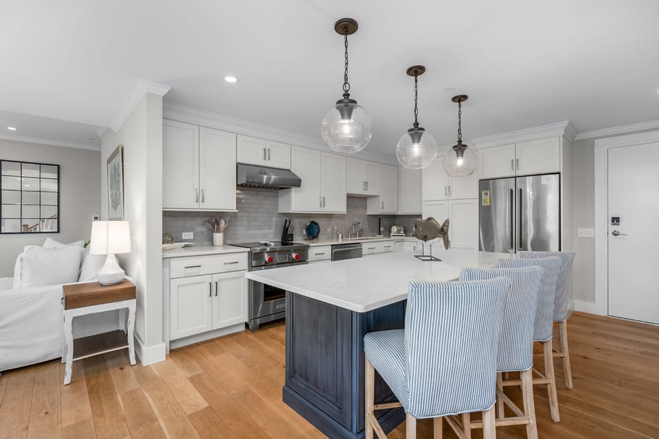 Luxurious open concept Kitchen with center island, seating for 4 at the bar, dishwasher and microwave.