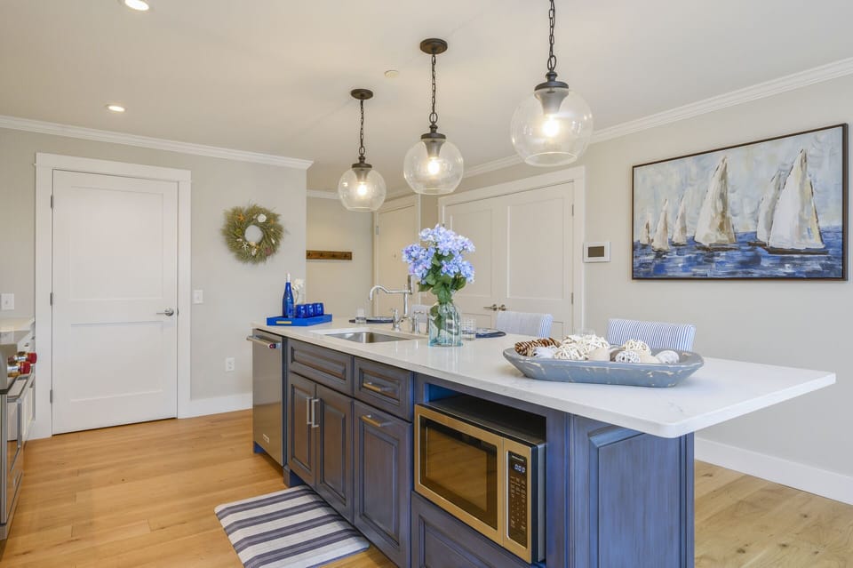 Large kitchen with island seating for 3 pantry closet and separate laundry is through the double doors.
