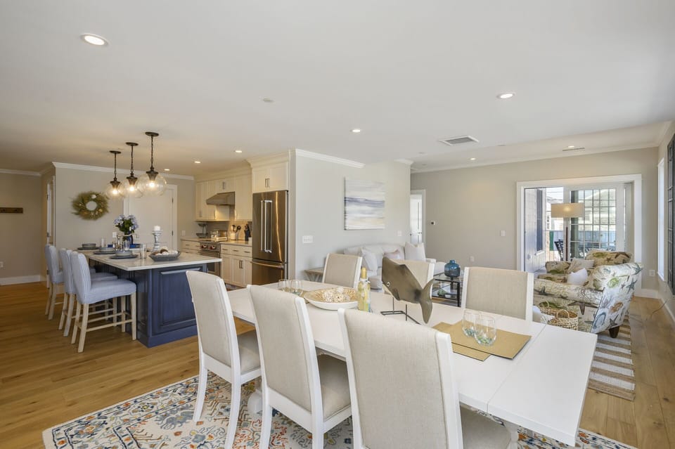 Open Concept Kitchen - Dining area looks into the living room and through to the balcony.