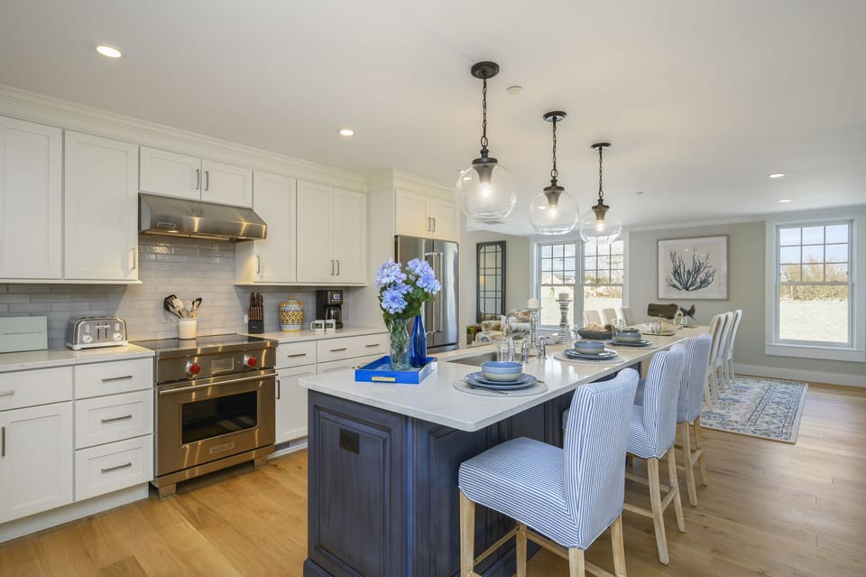 Open concept Kitchen - Dining area beyond, kitchen island with seating for 3.