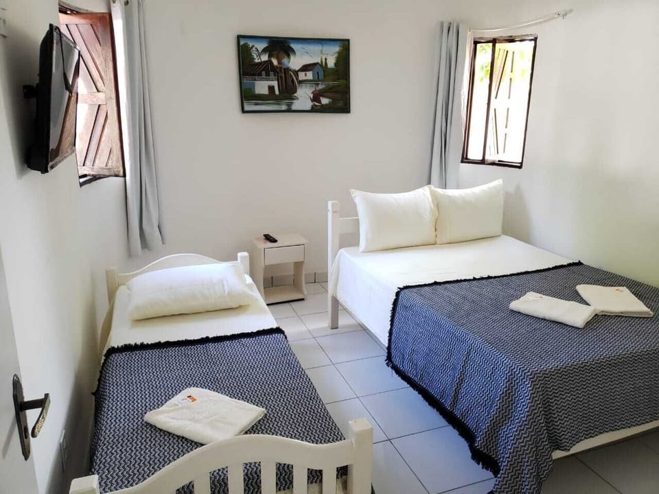 Standard Triple Room | Minibar, blackout drapes, free WiFi, bed sheets