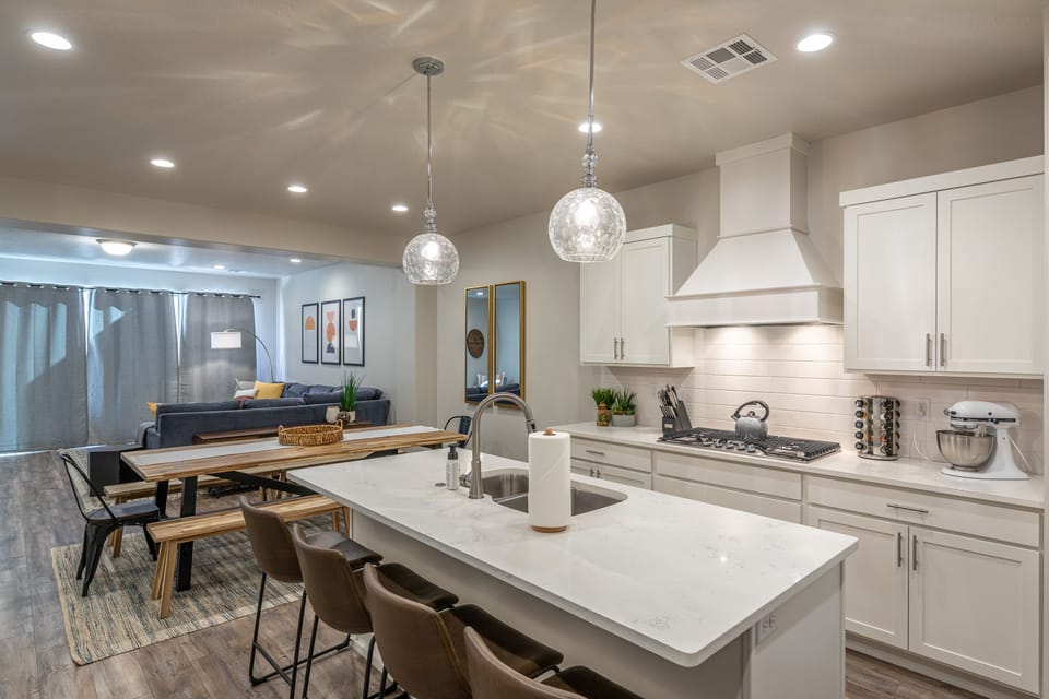 Kitchen - The Kitchen is complete with everything you will need for meal preparations including pots, pans, baking dishes, plates, cups, silverware, cutlery, and an assortment of cooking utensils.
