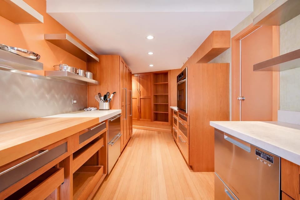 Spacious kitchen with beautiful wood cabinetry, generous counter space, and modern appliances for easy home cooking.