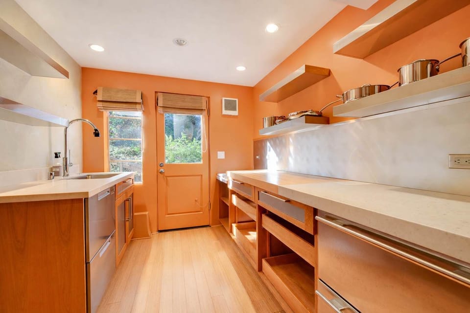 Bright and spacious kitchen with warm wood cabinetry, modern appliances, and plenty of counter space for cooking.