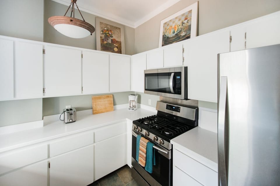 The kitchen offers high-end stainless steel appliances.