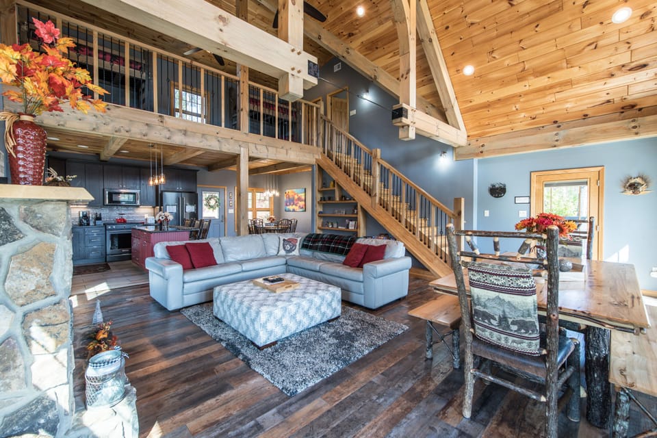Towering Beams in Great Room, with Sectional Couch, Big Screen TV, Deck Access