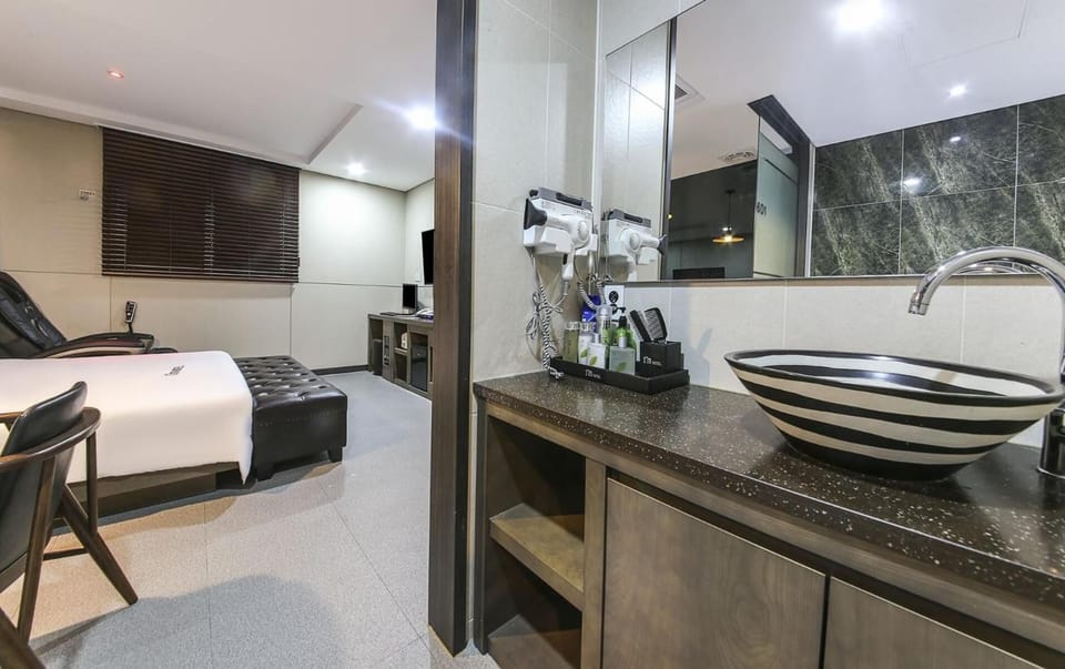 Separate tub and shower, hair dryer, towels, soap