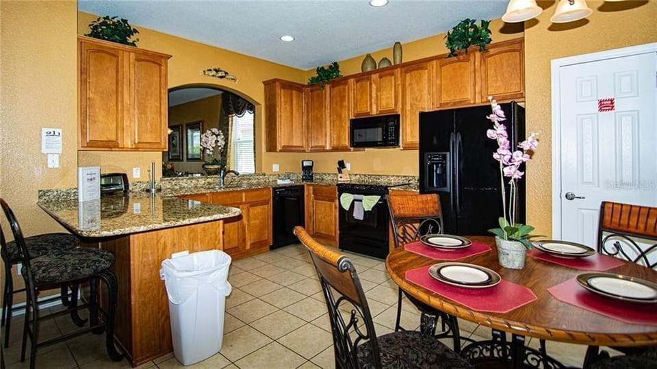 Kitchen with all the pots, pans, plates, and utinsels ready for your use