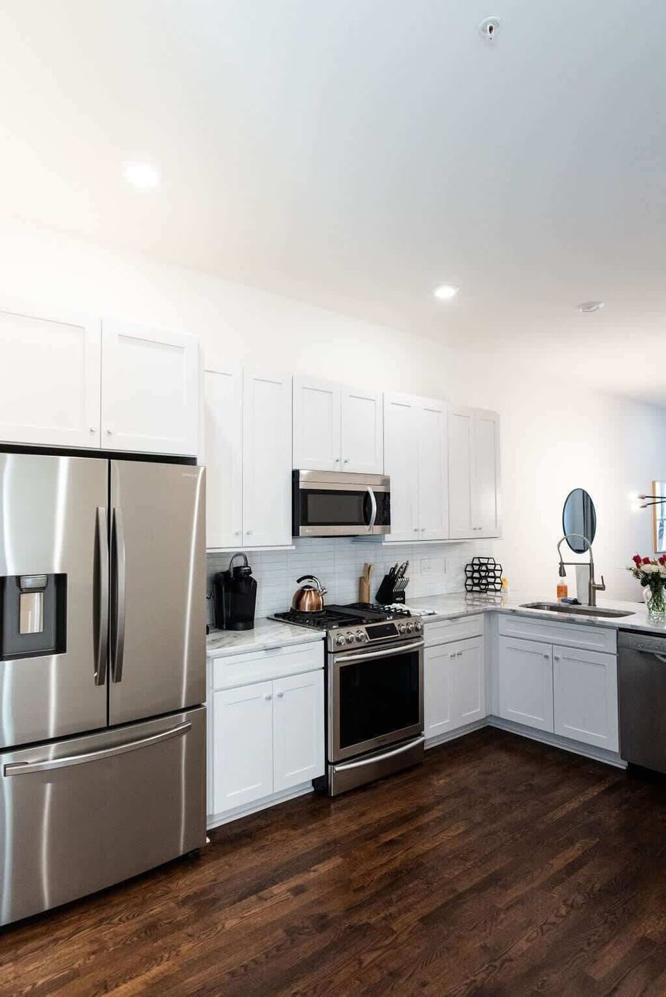 Stainless appliances top off this beautiful kitchen.