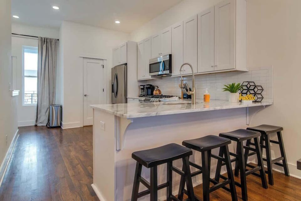 Pull up a seat at the kitchen bar—perfect for casual bites, morning coffee, or keeping the chef company.