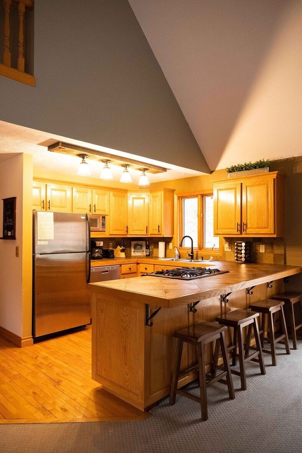 Kitchen with all stainless steel appliances including dishwasher and microwave. Fully stocked to make your vacation turn key. A spice rack is included.