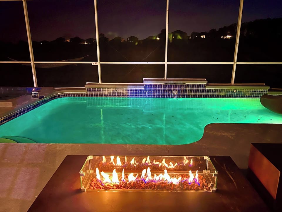 Exclusive Outdoor Oasis - Relax in our private pool with enchanting waterfalls and eclectic lighting. Play basketball with our pool basketball hoop or slide down the water slide. Unwind in the hot tub and enjoy a fine glass of wine by the Fire Pit.

