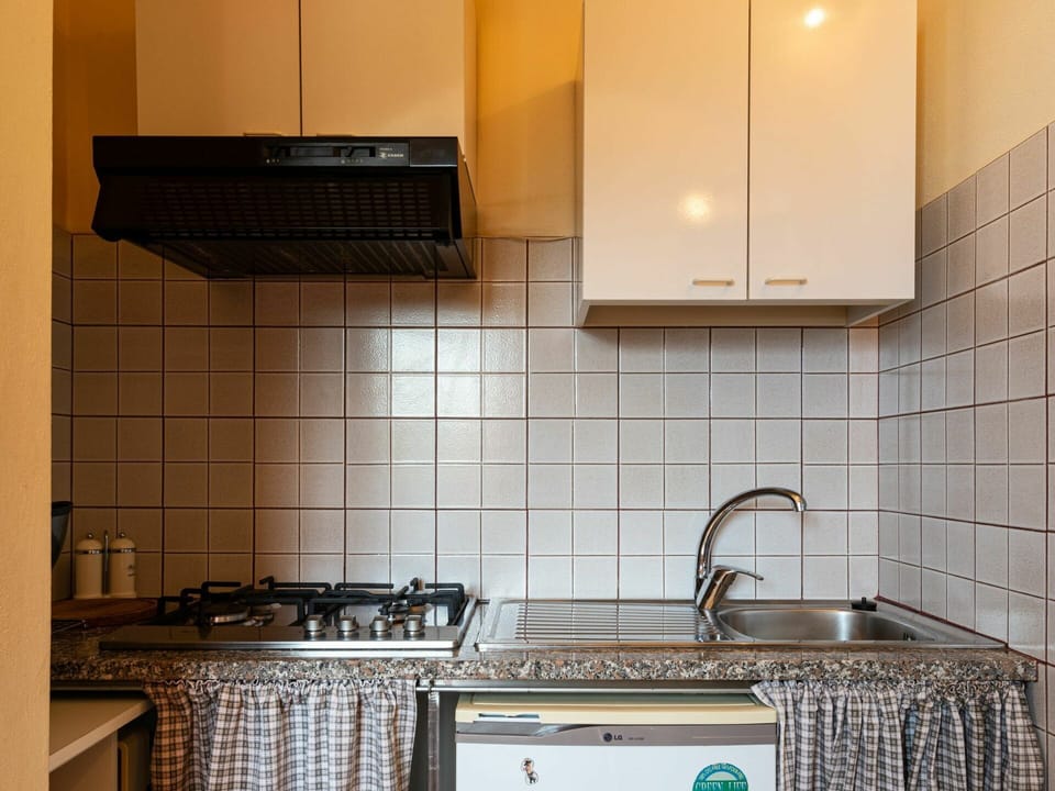 Tile, Room, Kitchen, Countertop, Property, Cabinetry, Furniture, Lighting, Interior Design, Sink